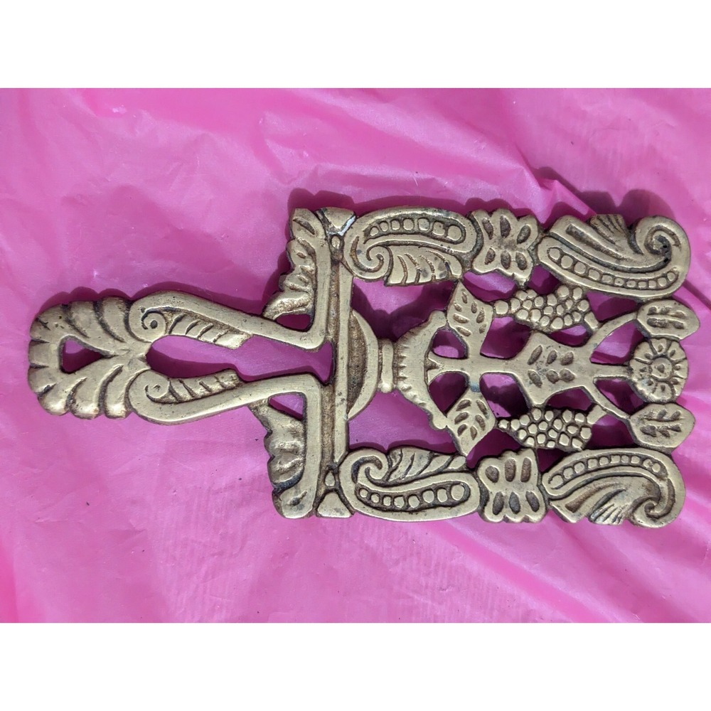 vintage brass scrolled design trivet with handle